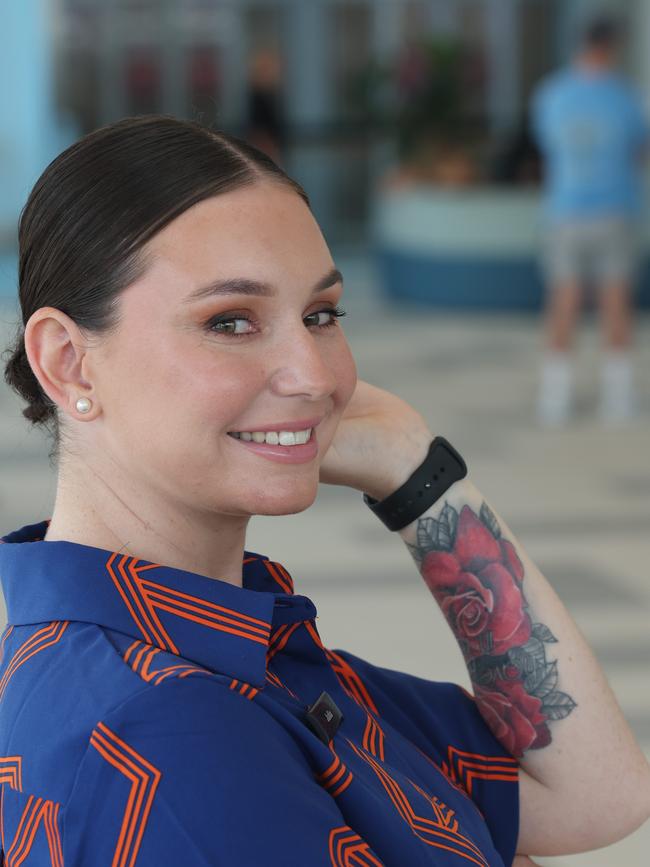 Airport crew member Julia Newbury is happy she is now allowed to show her tattoos. Picture: Glenn Hampson