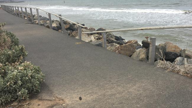 The rock wall and coastal path at West Beach which has been closed off it was severely damaged by storms in May.