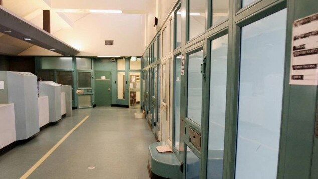 Inside the Brisbane watch house showing processing cells where prisoners are held before having details taken.