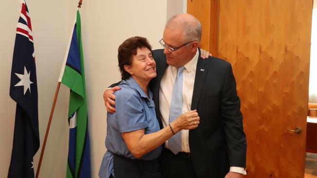 Prime Minister Scott Morrison gets a hug from Parliament House cleaner Anna Jancevski after his speech on Thursday. Picture: Adam Taylor