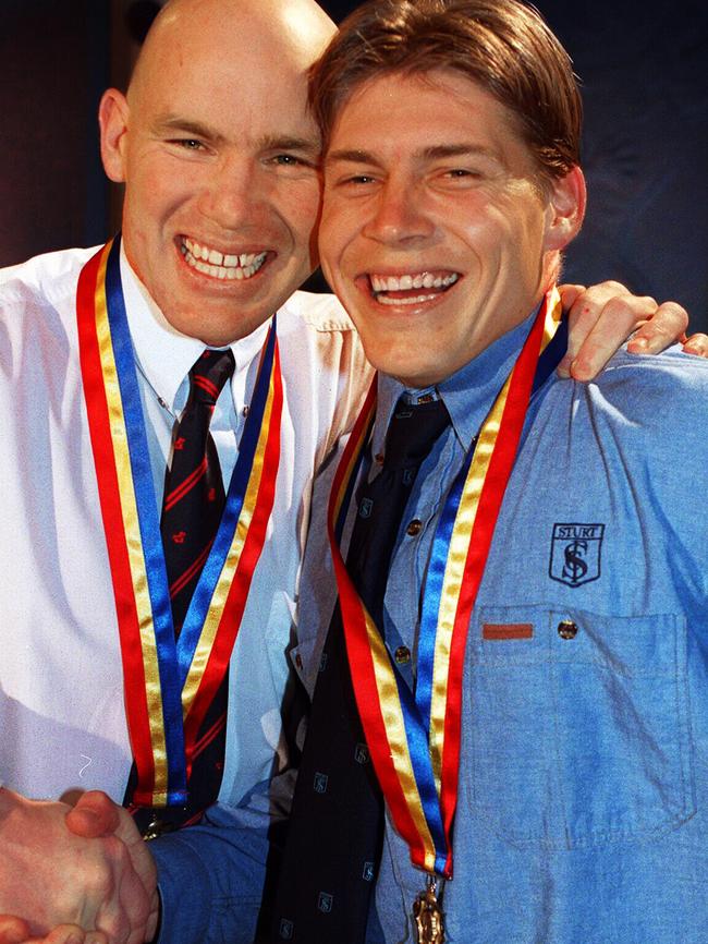 Brodie Atkinson (right) with SA football great Andrew Jarman after they tied for the 1997 Magarey Medal.