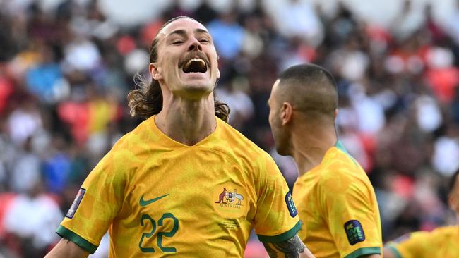 Australia's midfielder #22 Jackson Irvine celebrates after scoring his team's first goal during the Qatar 2023 AFC Asian Cup Group B football match between Australia and India at the Ahmad bin Ali Stadium in Al-Rayyan, west of Doha on January 13, 2024. (Photo by HECTOR RETAMAL / AFP)