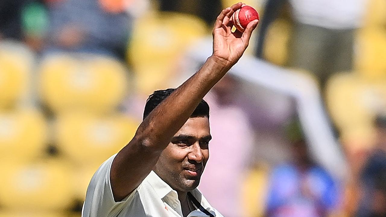 Ravichandran Ashwin raises the ball after taking five wickets. Picture: AFP