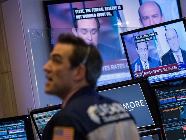 NEW YORK, NY - JANUARY 27: A trader on the floor of the New York Stock Exchange reacts to the news that the Federal Reserve will not raise interest rates during the afternoon of January 27, 2016 in New York City. The Federal Reserve last raised rates in December, 2015. Andrew Burton/Getty Images/AFP == FOR NEWSPAPERS, INTERNET, TELCOS & TELEVISION USE ONLY ==