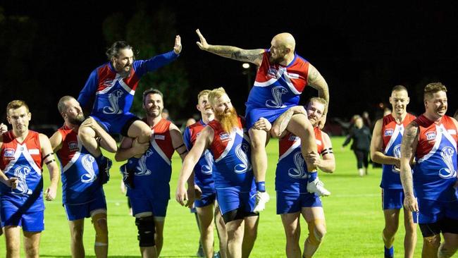 Sandown Cobras carry Ricky Logan and Ricky Ettridge off the ground. Pic: Sandown FC.