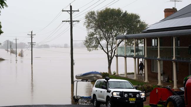 A house on the edge of floodwater in Windsor, Sydney, in July last year. Picture: NCA NewsWire / James Gourley