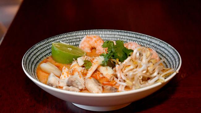 Buzuka chef Hongbin Yu with some of the new dishes on offer. Malaysian Seafood Curry. Picture: Evan Morgan