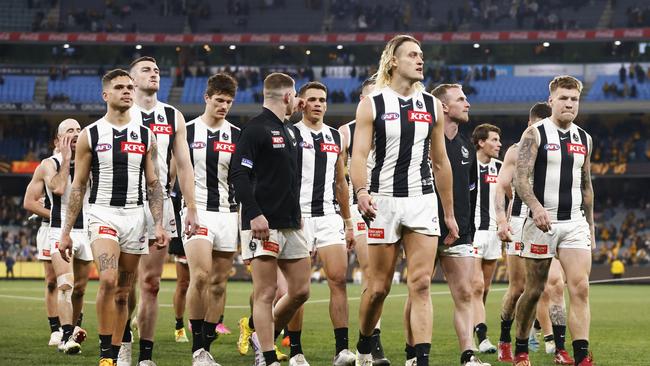 Darcy Moore leads Collingwood off. Picture: Daniel Pockett/Getty Images