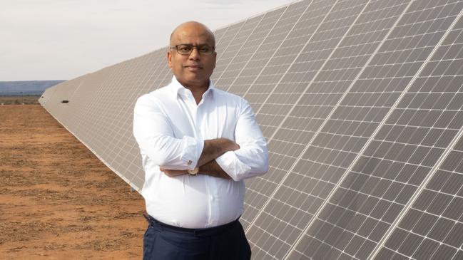 GFG Alliance executive chairman Sanjeev Gupta next to the Cultana solar plant test rig.