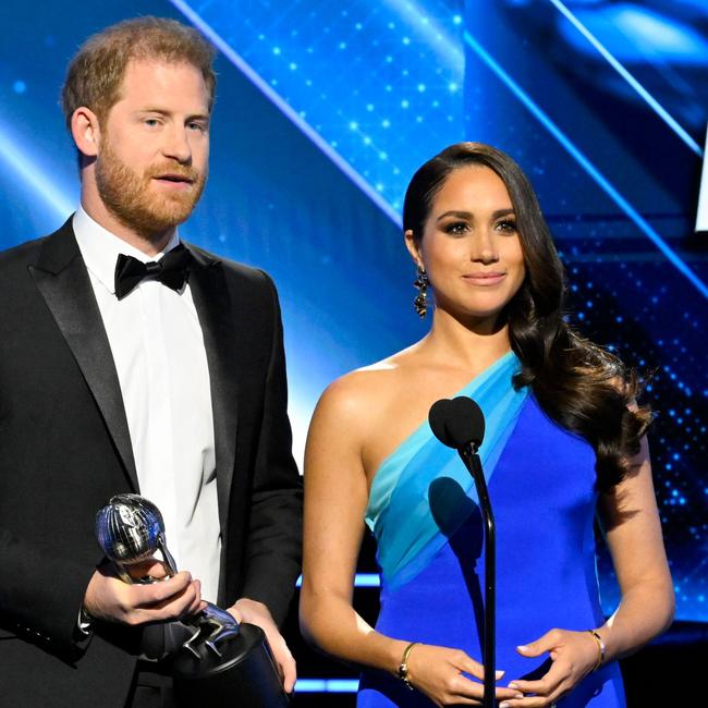 Meghan looked stunning in royal blue as they accepted the ward. Picture: Earl Gibson III/Shutterstock