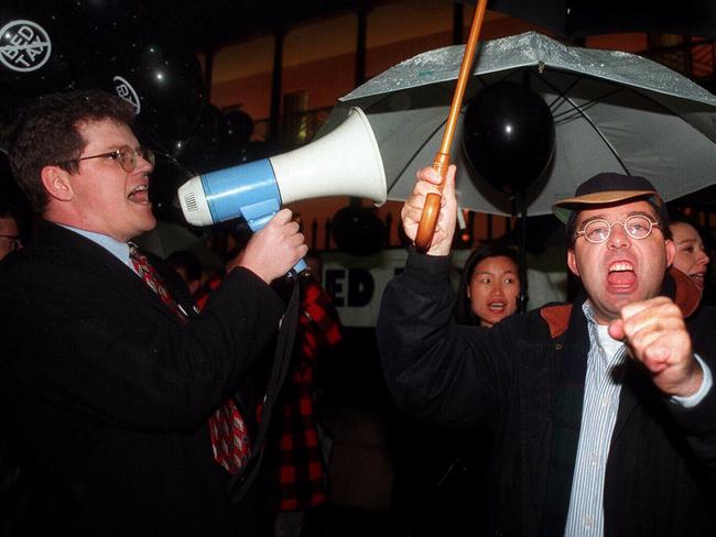 ‘What do we want? No more protests! When do we want it? Now!’. Scott Morrison and Michael Photios enthusiastically protest against a planned bed tax in 1997.