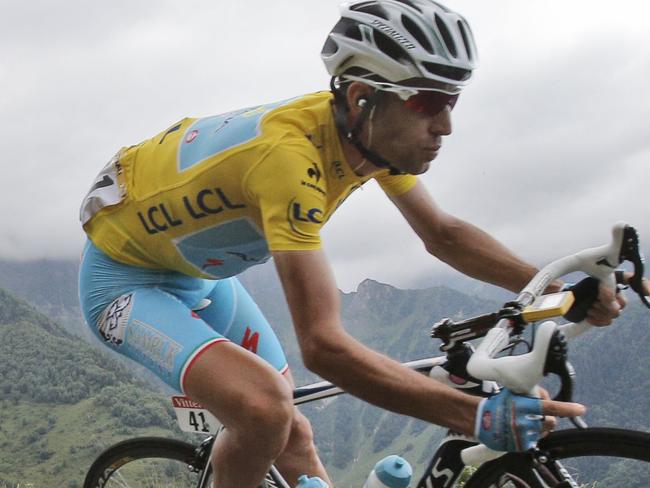 Italy's Vincenzo Nibali, wearing the overall leader's yellow jersey, speeds down Val Louron Azet pass during the seventeenth stage of the Tour de France cycling race over 124.5 kilometers (77.4 miles) with start in Saint-Gaudens and finish in Saint-Lary, France, Wednesday, July 23, 2014. (AP Photo/Christophe Ena)