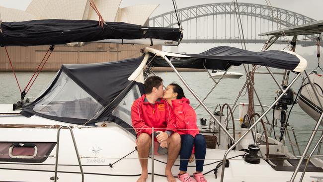 David Fair and Ally He celebrate the new year in Sydney Harbour after he sailed around the world. Picture: Michael Bilbe-Taylor