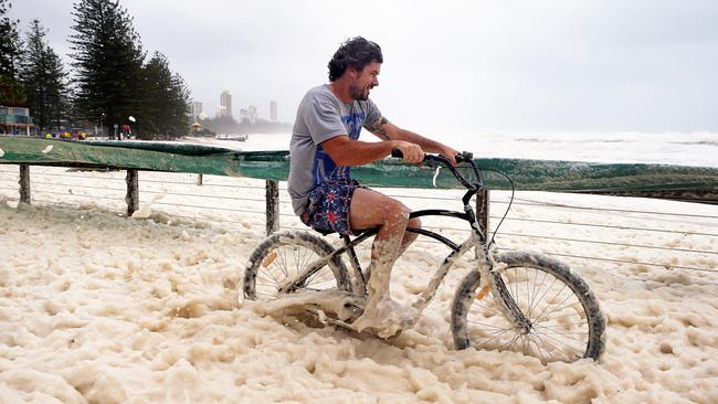 Burleigh Beach has become a sea of foam. Picture: Adam Head