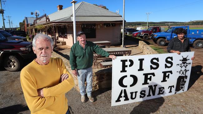 Swiss Mountain Hotel owner Jim Frangos with local farmers Kevin Clohesy and Anthony Fraser. Picture: Alex Coppel