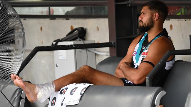 Patrick Ryder on the bench with ice on his Achilles.