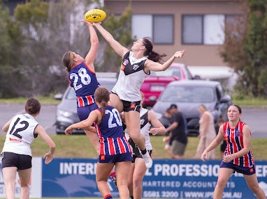 A ruck contest between the Southport and Grange girls.