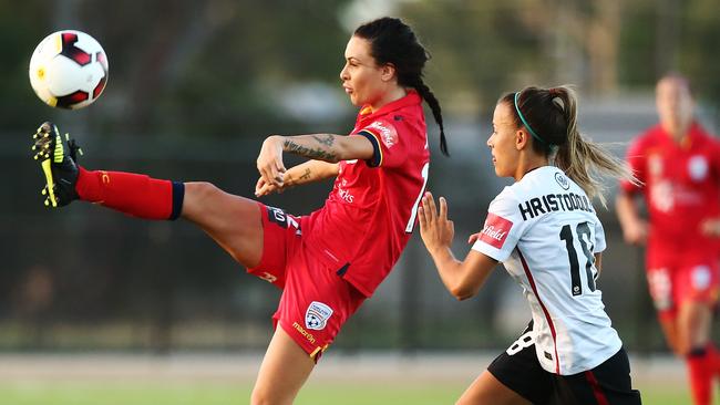 In form ... Adelaide United’s Adriana Jones wins the ball in front of the Wanderers’ Angelique Hristodoulou. Picture: Morne de Klerk (Getty Images)