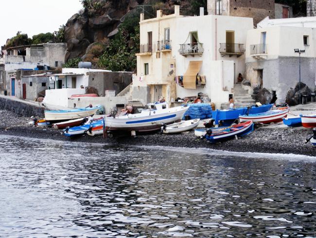 Boats on beach of Alicudi island of Eolie archipelago. Sicily. Italy