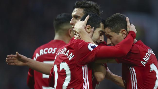 Mkhitaryan celebrates scoring their first goal with teammate Ander Herrera.