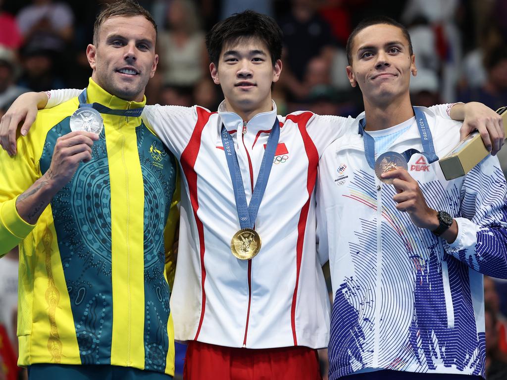 Kyle Chalmers shows off his silver medal alongside gold medalist Zhanle Pan and bronze medalist David Popovici. Picture: Getty Images