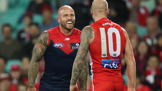 Nathan Jones crosses paths with his brother, Sydney's Zak Jones. Picture. Phil Hillyard