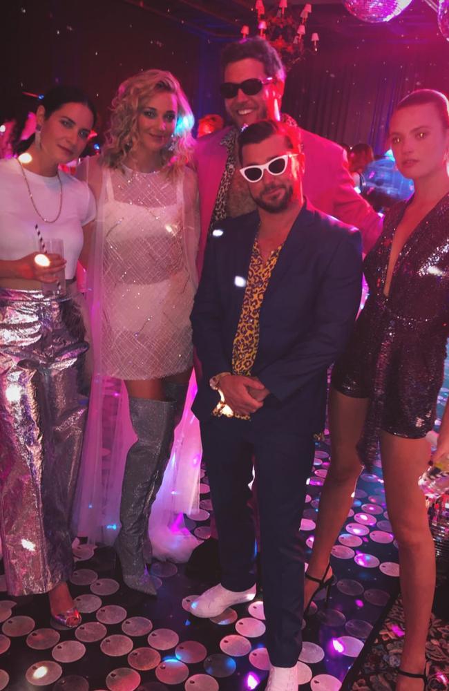 TV broadcaster Corbin Harris, middle, with Jasmine Yarbrough in a sheer outfit white outfit with thigh-high silver boots and Australian model Montana Cox, far right. Picture: Instagram/@corbinharris