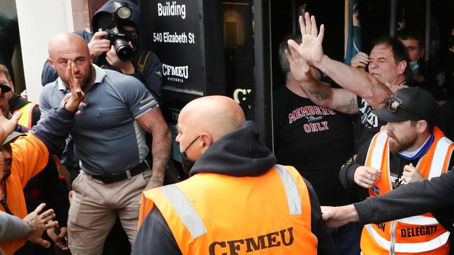 Victorian CFMEU secretary John Setka attempts to talk to construction workers during protests last week. Picture: David Crosling