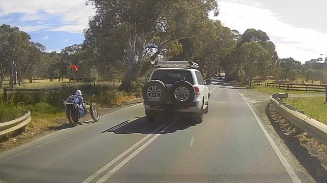 A horrifying near-miss involving a truck, a cyclist and a 4WD was captured on dashcam video on Main South Rd at Wattle Flat. Picture: Supplied
