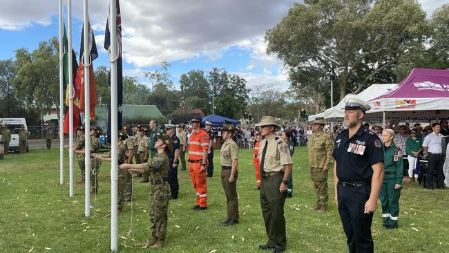 A guard of honour observes a flag-raising ceremony at the Alice Springs citizenship ceremony and Centralian of the Year award presentations. Picture: Daniel Wood