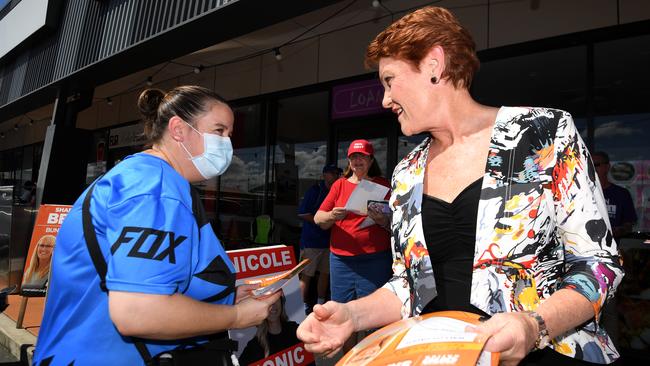 One Nation leader Senator Pauline Hanson hands out how-to-vote cards for the Bundamba by-election at Redbank Plains, west of Brisbane, last week. (AAP Image/Dan Peled) NO ARCHIVING