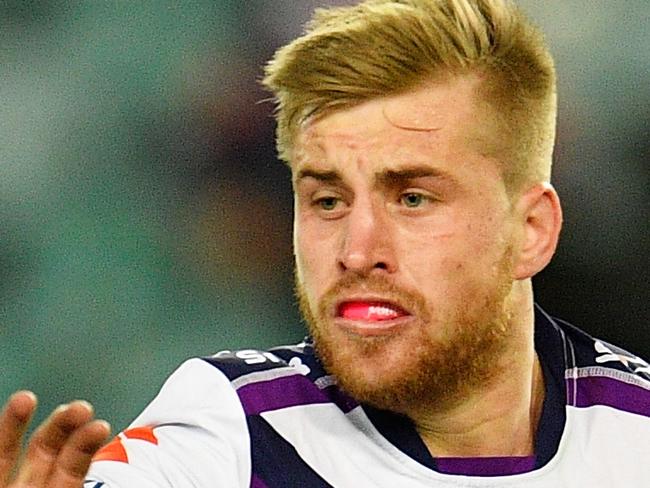 SYDNEY, AUSTRALIA - JUNE 11:  Cameron Munster of the Storm makes a break during the round 14 NRL match between the Sydney Roosters and the Melbourne Storm at Allianz Stadium on June 11, 2016 in Sydney, Australia.  (Photo by Brett Hemmings/Getty Images)