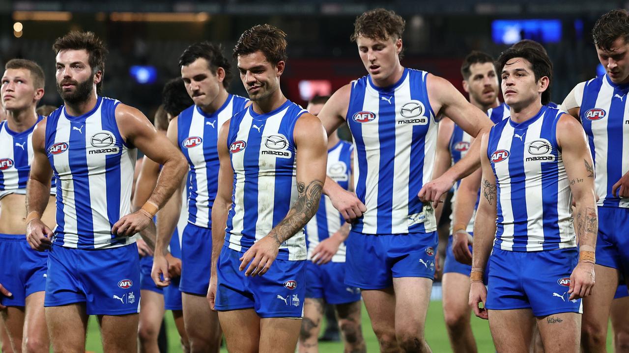 MELBOURNE, AUSTRALIA - APRIL 21: The Kangaroos look dejected after losing the round six AFL match between North Melbourne Kangaroos and Hawthorn Hawks at Marvel Stadium, on April 21, 2024, in Melbourne, Australia. (Photo by Quinn Rooney/Getty Images)