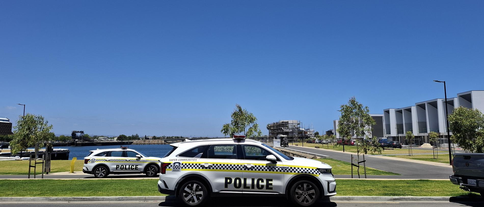 About five SA police officers, including members of the Water Operations Unit, remained at scene where a body was discovered at New Port on Tuesday afternoon.