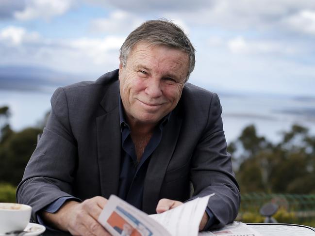 Charles Wooley reading the paper at his local cafe, the Signal Station in Mt Nelson. TasWeekend. Charles Wooley cover story