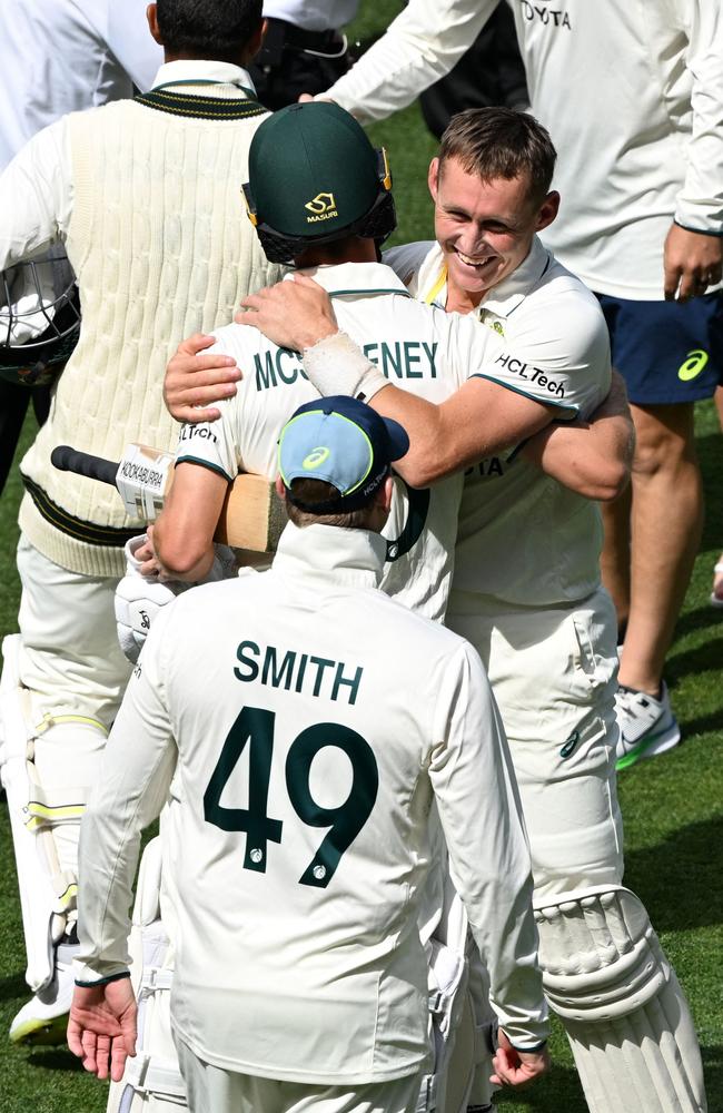 Marnus Labuschagne hugs Nathan McSweeney after Australia’s win on day 3. Picture: Michael ERREY / AFP