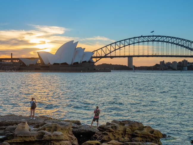 Sunset view of Sydney Harbour Bridge and Sydney Opera House on the banks of the Parramatta River