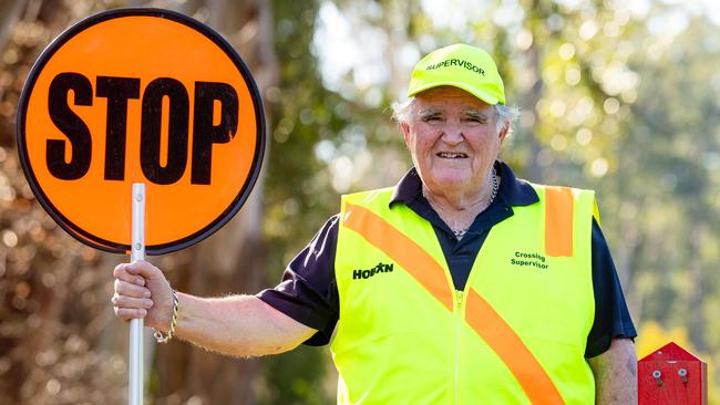 Crossing Supervisor John Goulden doing his job at the crossing near Mt Dandenong Primary School. He has been banned from high-fiving kids. Picture: Jason Edwards