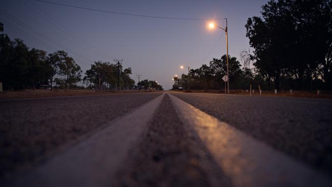 The Stuart Highway at sunrise in the township of Larrimah