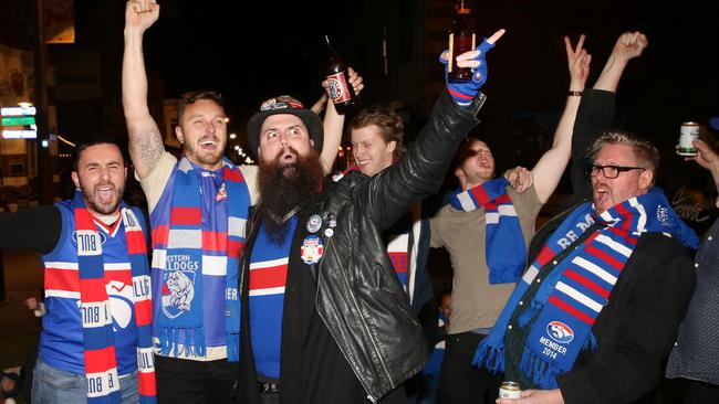 Bulldog fans party in Yarraville outside the Sun Theatre. Picture: Mark Wilson