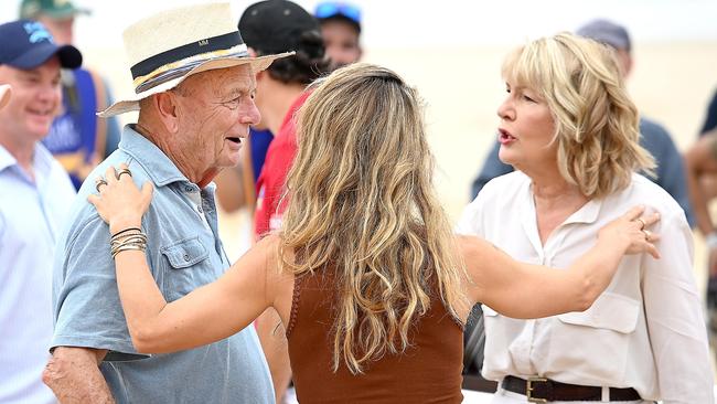 Pataky caught up with Gerry Harvey and his wife Katie Page at the barrier draw for the Magic Millions race following the beach dash. Picture: NCA NewsWIRE / John Gass