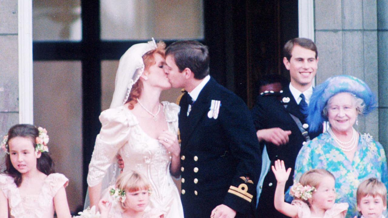 Duke of York Prince Andrew kisses his bride Sarah Ferguson on balcony of Buckingham Palace following their wedding at Westminster Abbey in 1986.