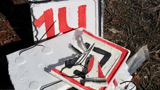 Damaged emu warning signs on Brooms Head road.