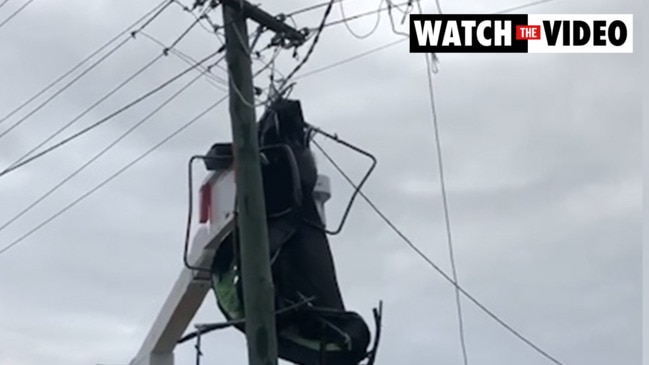 Wild winds cause trampoline to fly into powerlines