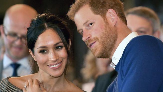 Britain's Prince Harry with bride to be Meghan Markle as they watch a dance performance by Jukebox Collective during a visit to Cardiff, Wales. Picture: Ben Birchall/Pool via AP.