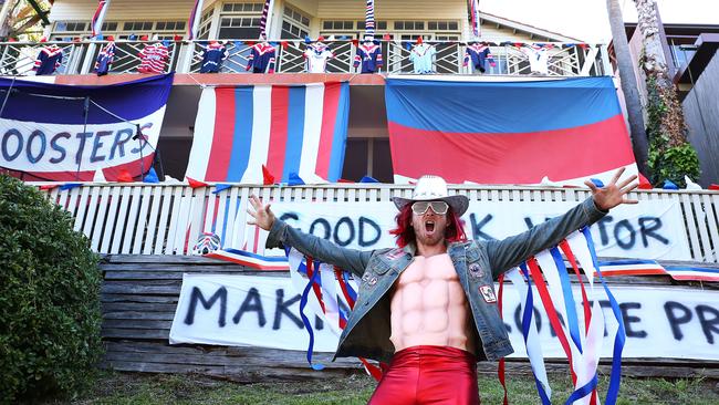 Roosters supporter Robert Bruns outside the decorated house last year.