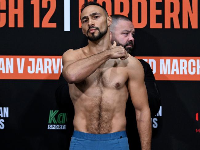 Thurman makes a throat-slitting gesture on the scales. Picture: No Limit Boxing/Gregg Porteous