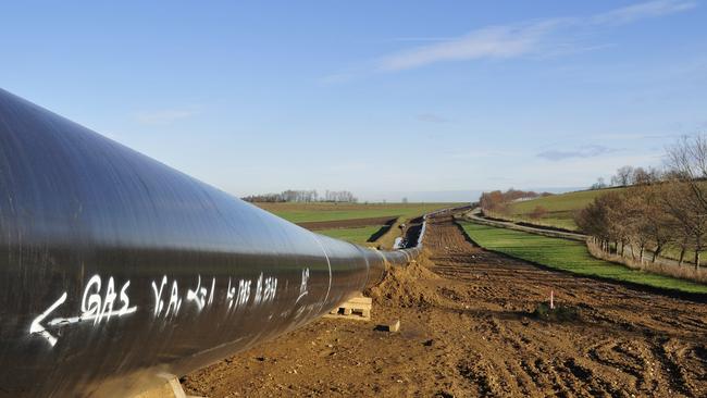 Generic picture of a gas pipeline being constructed in a hilly landscape.