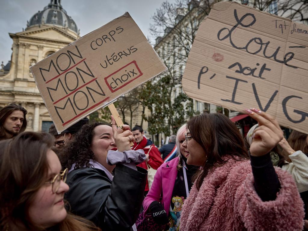Protesters hold a slogan which reads "My body, My uterus, My choice" during a silence gathering in front of the French Senate organised by 'Abortion in Europe' movement. Picture: Kiran RIDLEY / AFP)