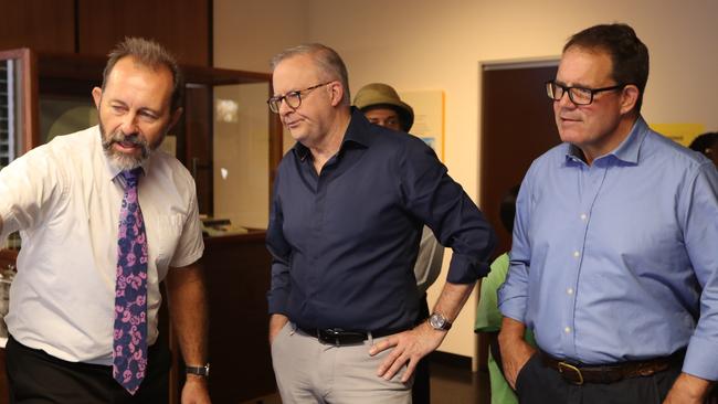 Territory historian Jared Archibald, Prime Minister Anthony Albanese and Member for Solomon Luke Gosling looking at the BOM display at the MAGNT Cyclone Tracy exhibition on December 24, 2024. Picture: Sam Lowe